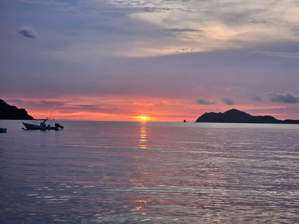 Sunset over anchored boats in the bay at Playas del Coco, Guanacaste